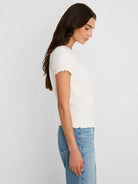 White lace knit t-shirt with short ruffled sleeves and hem.