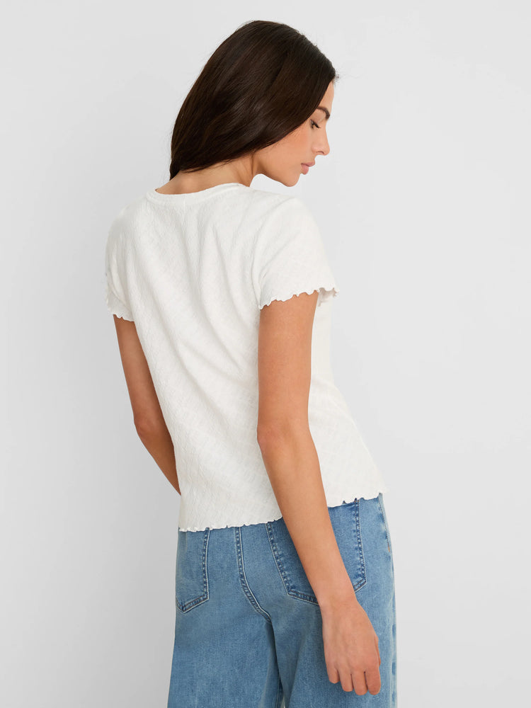 Off-white lace knit t-shirt featuring a subtle textured pattern and scalloped edges on short sleeves and hem.
