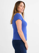 Blue lace knit t-shirt with ruffled sleeves and hem.