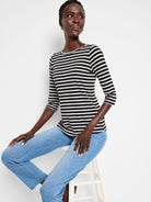 Black and white striped 3/4 sleeve boat neck tee.