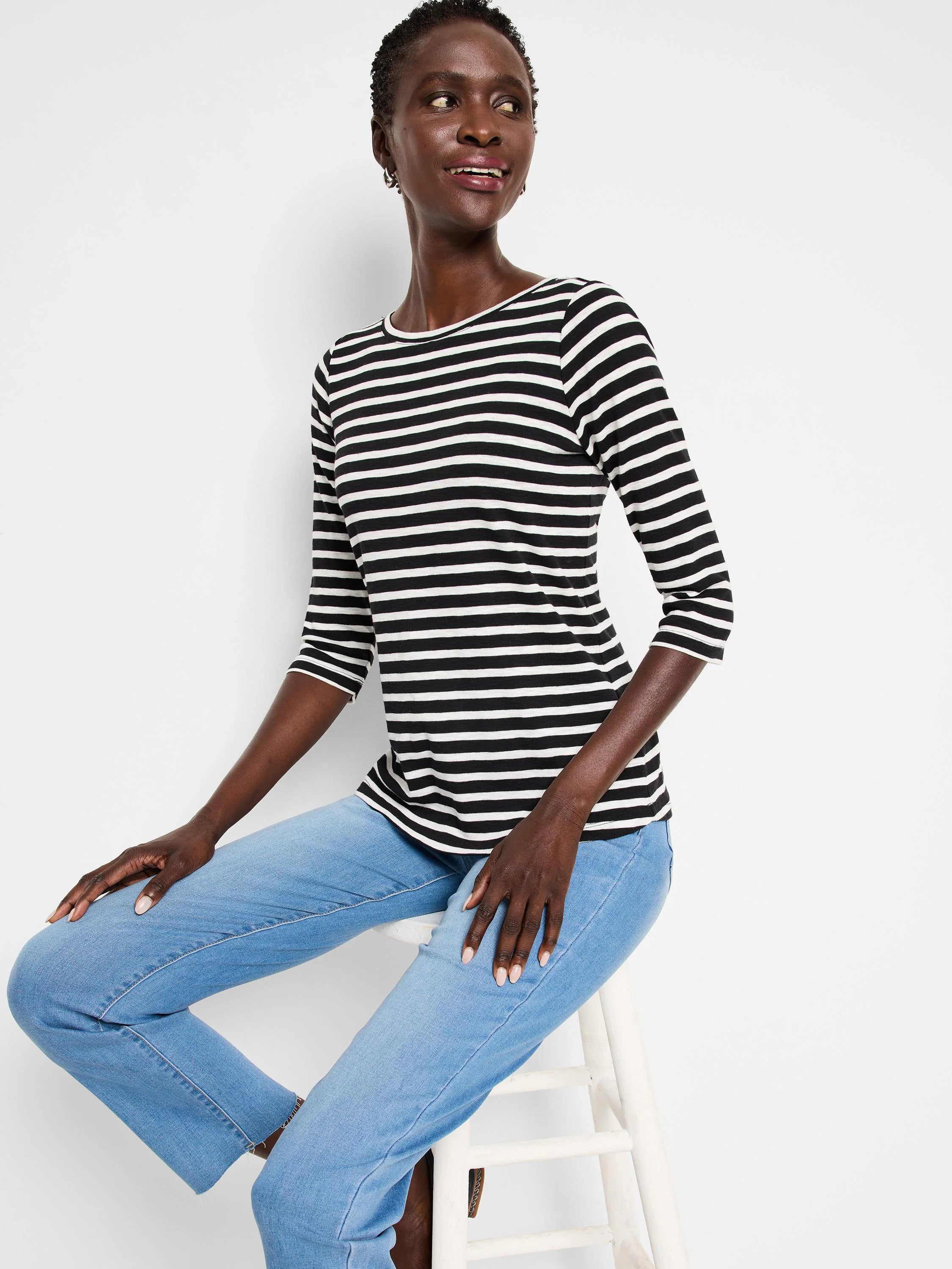 Black and white striped 3/4 sleeve boat neck tee.
