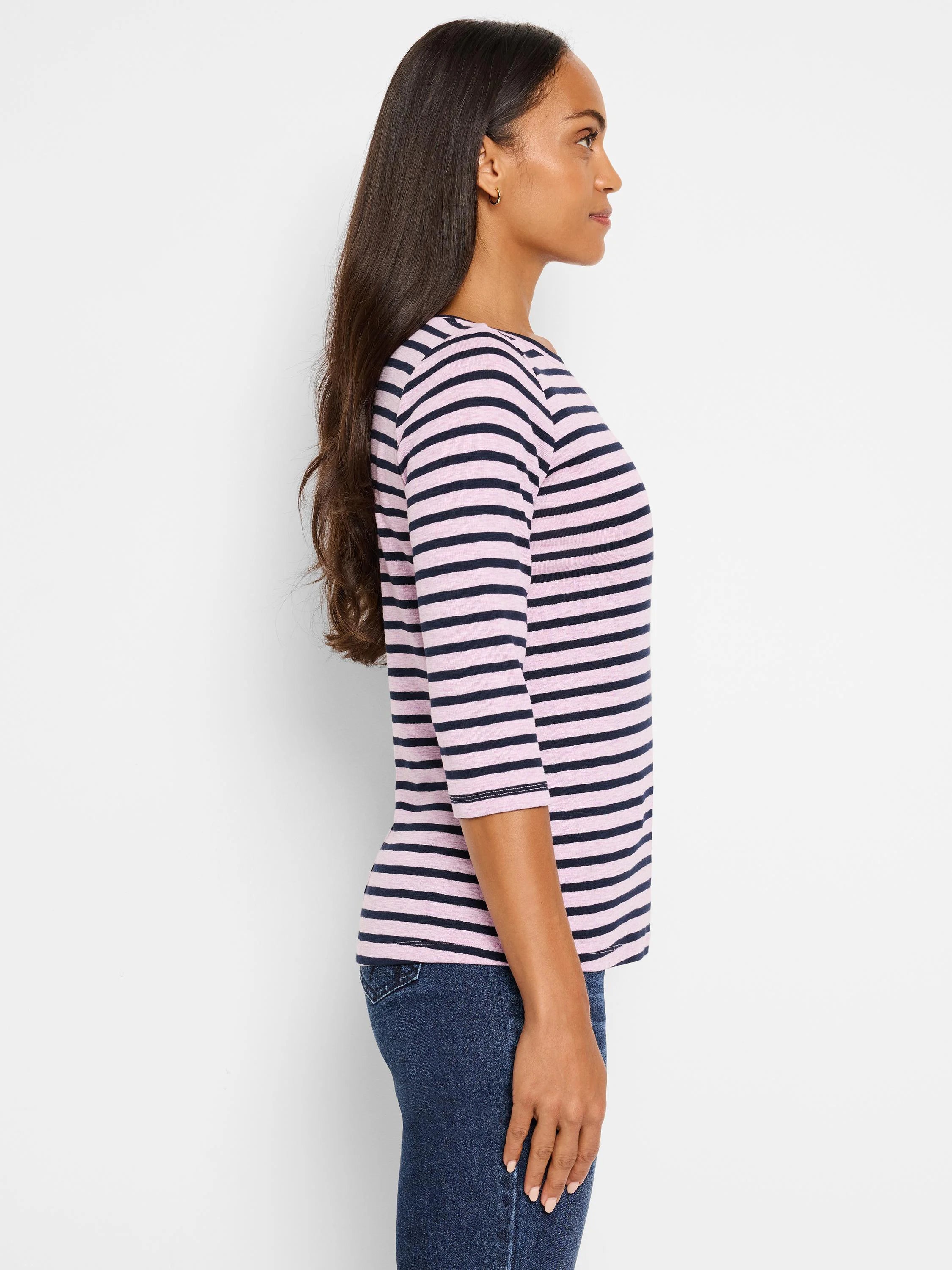 Model wearing a light pink and navy blue horizontally striped 3/4 sleeve boat neck tee.