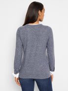 Here's alt text for the image, aiming for under 125 characters:

Gray double-layered top, white cuffs, long sleeves. ...