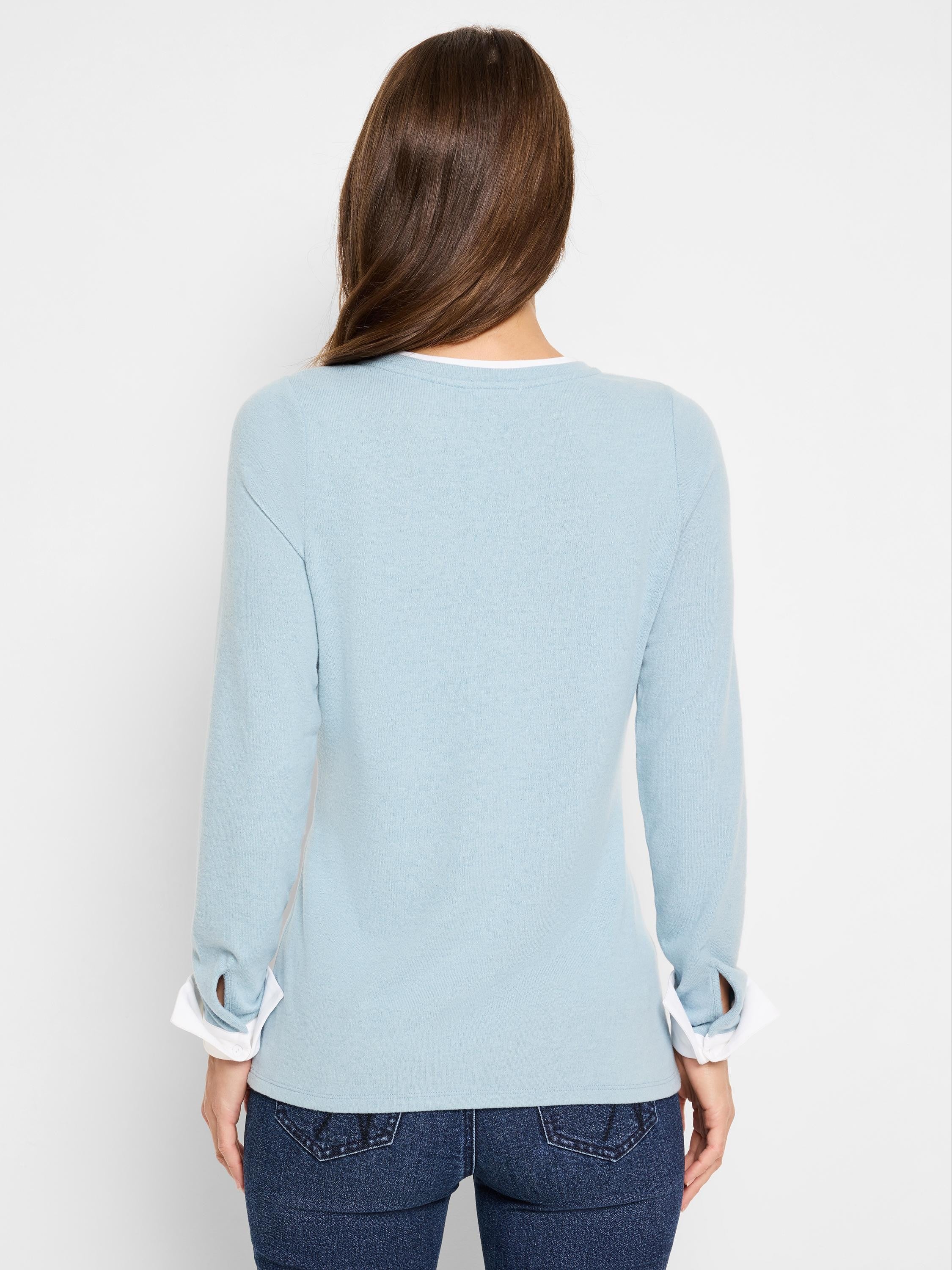 Here's alt text for the image, under 125 characters:

"Back view of a light blue, double-layered sweater with long...