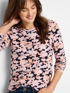 Long-sleeve crew neck tee with pink, black, and beige abstract print.