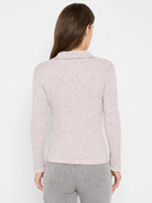 Light pink ribbed knit long sleeve polo with dark speckles and a collar, shown from the back.