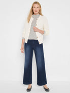 Off-white & black horizontal striped long sleeve mock neck tee.