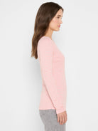 Model wears a pink long sleeve boat tee with light grey horizontal stripes.