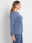 Long sleeve boat neck tee with horizontal dark blue and light blue stripes.