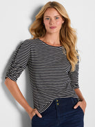 A relaxed, striped navy and white boat neck top featuring gathered three-quarter length sleeves.