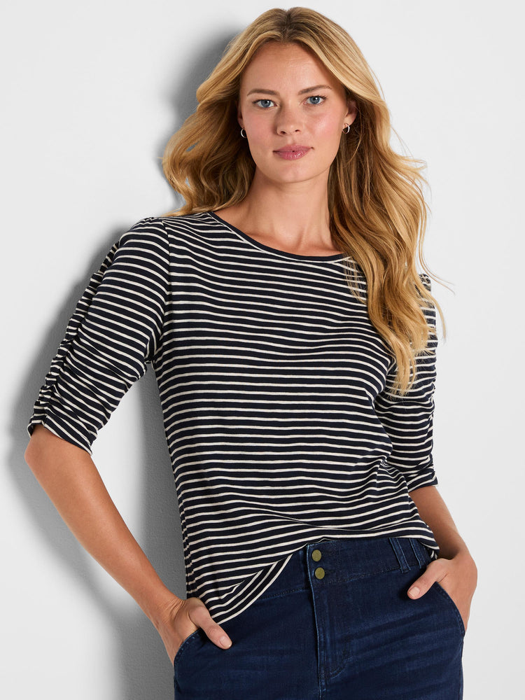 A relaxed, striped navy and white boat neck top featuring gathered three-quarter length sleeves.