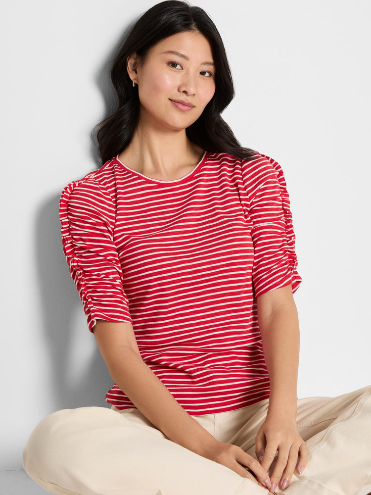 A fitted red and white striped knit top with a round neck and gathered, elbow-length ruched sleeves.