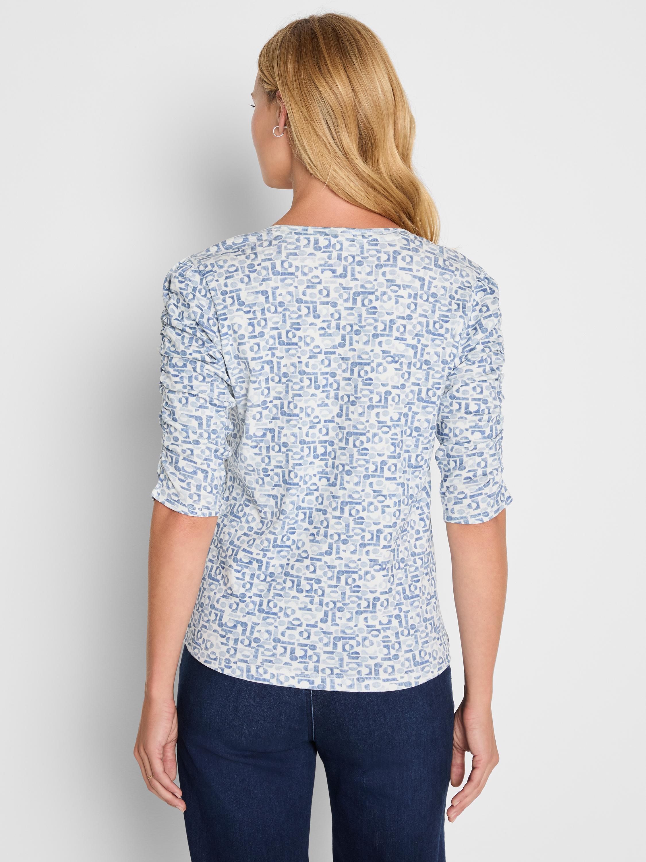 Fitted blue and white abstract print top with three-quarter length gathered sleeves.