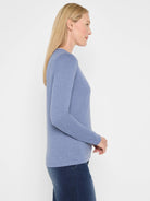 Light blue long-sleeve jersey tee, featuring a subtle split neck and soft texture. Relaxed fit.