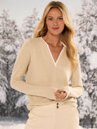 Light beige jersey tee with a white double-layer split V-neck and long sleeves.