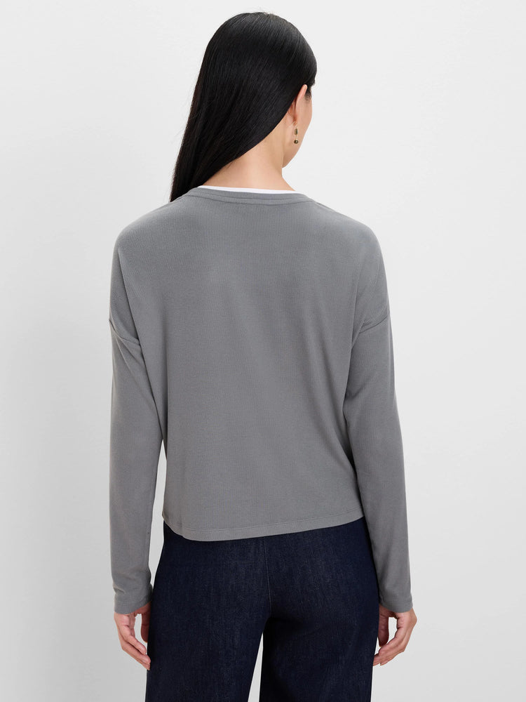 Gray ribbed long-sleeve top with white layer at crew neck.