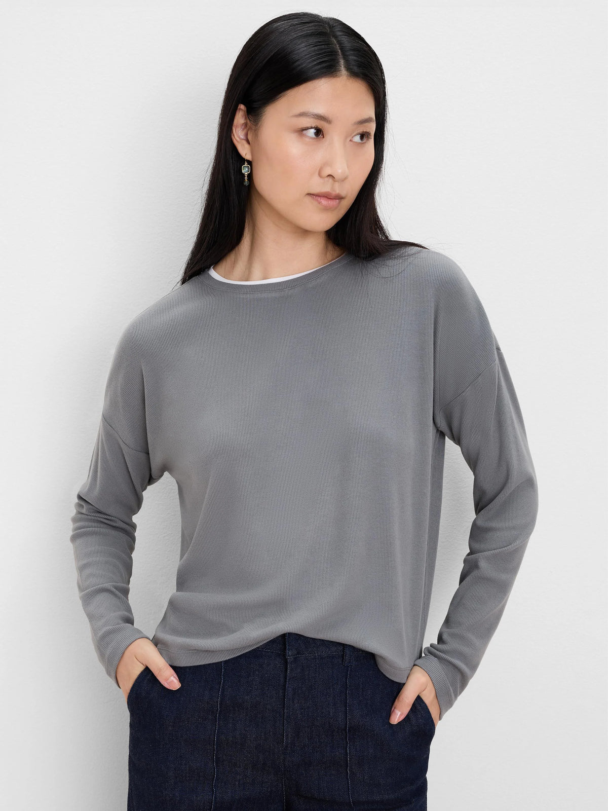 Grey ribbed long-sleeve top with a white double layer visible at the crew neck.