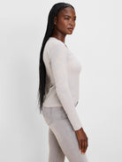 Fitted long sleeve tee with thin horizontal oatmeal and white stripes.