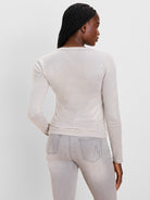 Fitted long sleeve tee with thin horizontal cream and light taupe stripes, subtle brushed finish.