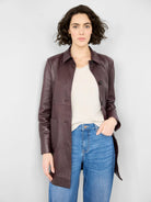 Burgundy leather car coat;  button front, hip-length,  long sleeves.