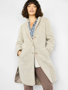 Beige herringbone wool coat with taupe trim.  Three buttons.  Side pockets.  Lined.