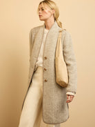 Tan and cream herringbone wool blend top coat, collarless, with round brown buttons and solid beige trim.