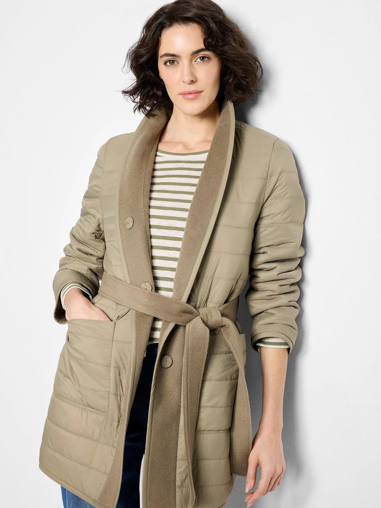 Beige quilted coat with a wool lining, belted waist, and single button closure.  Reversible to show a solid beige wool side.