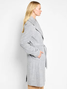 Light gray belted wrap coat, long sleeves, pockets.