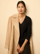 Camel alpaca wool blend wrap coat with a fuzzy texture and notched lapel.