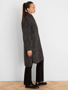 Charcoal and light grey jacquard top coat with a subtle zigzag pattern, mid-length, featuring black trim on edges and...