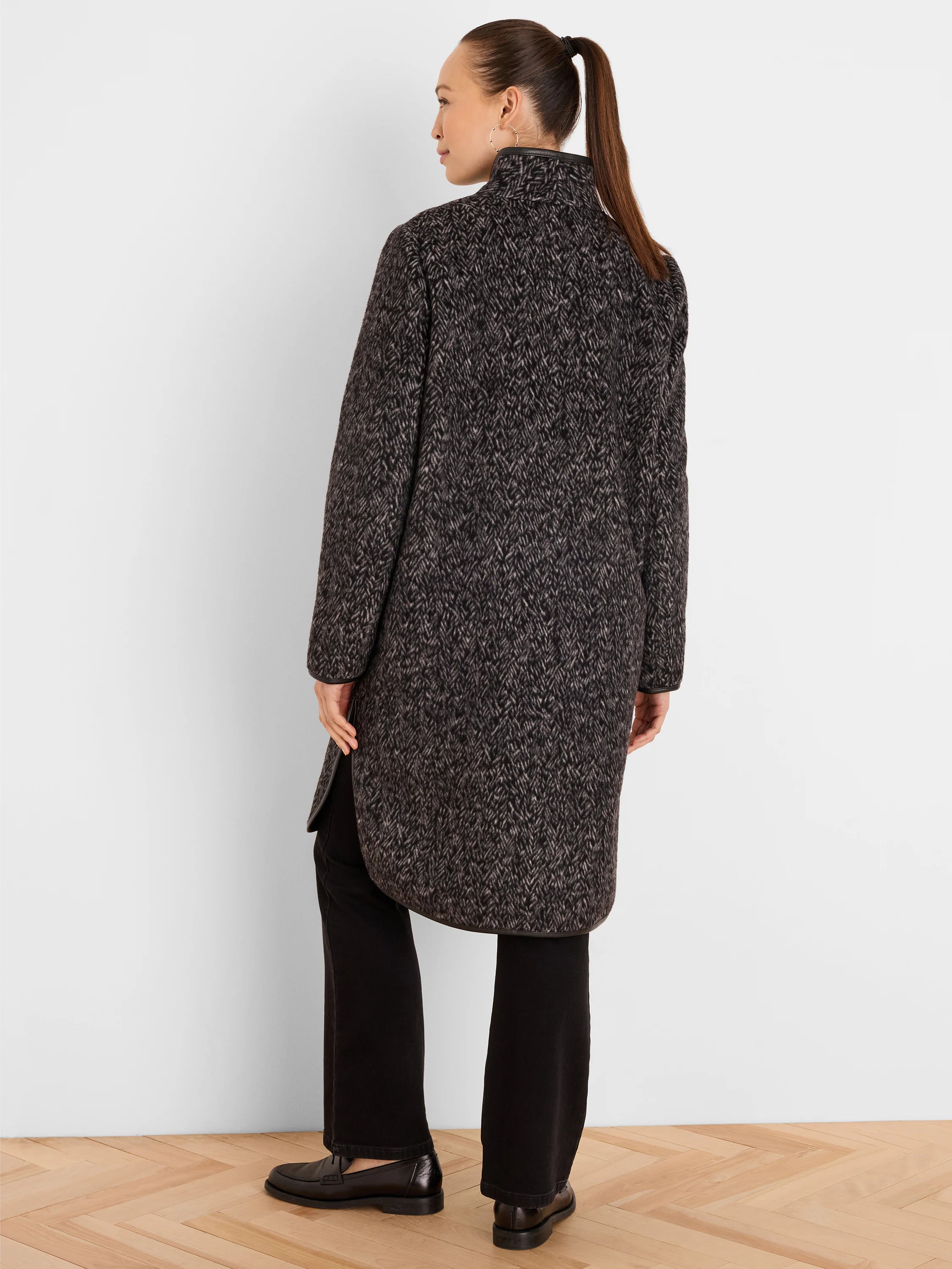 Dark/light gray jacquard top coat. Stand collar, rounded hem, black leather trim on collar and hem.