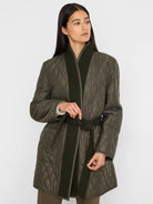 Reversible quilted olive green top coat with darker green wool lapels & tie-belt.