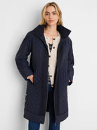 Navy parka with quilted wavy pattern body, knit collar, shoulders & side panels. Zip closure.