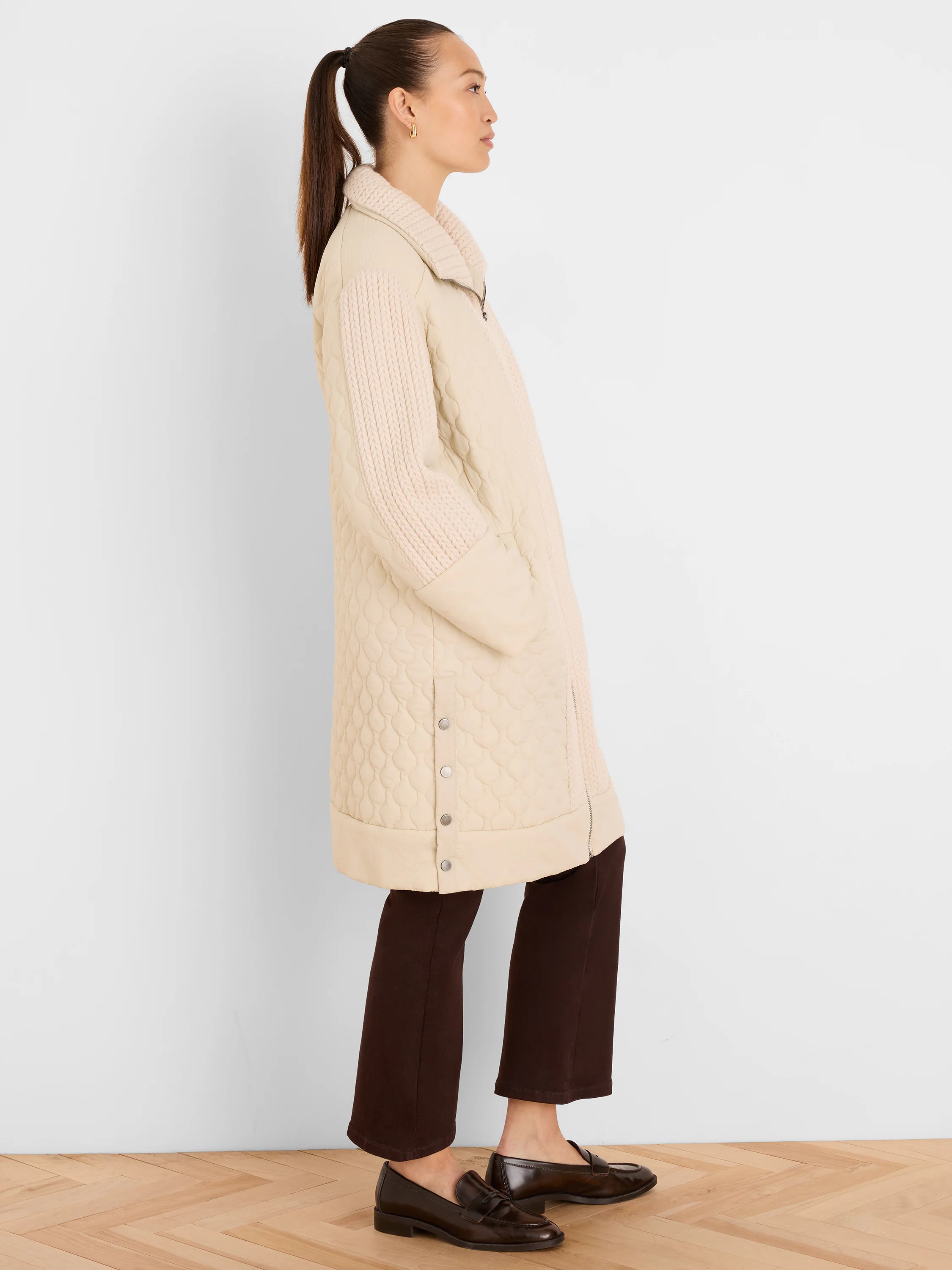 Light beige mixed media parka: quilted body, ribbed knit collar & sleeves, full zip, silver side snaps.
