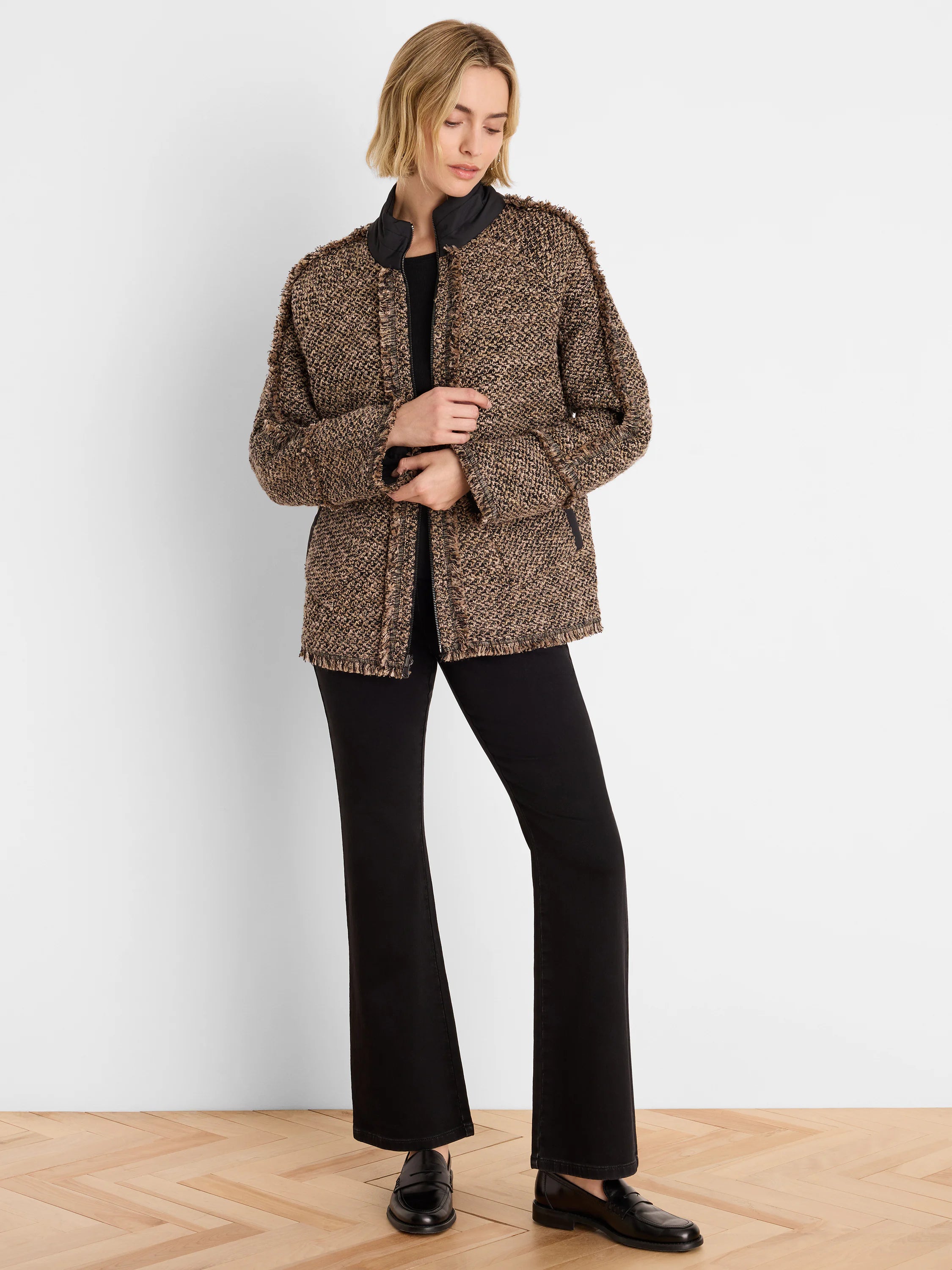 Short brown and black textured coat with fringe detail along edges, black stand collar.
