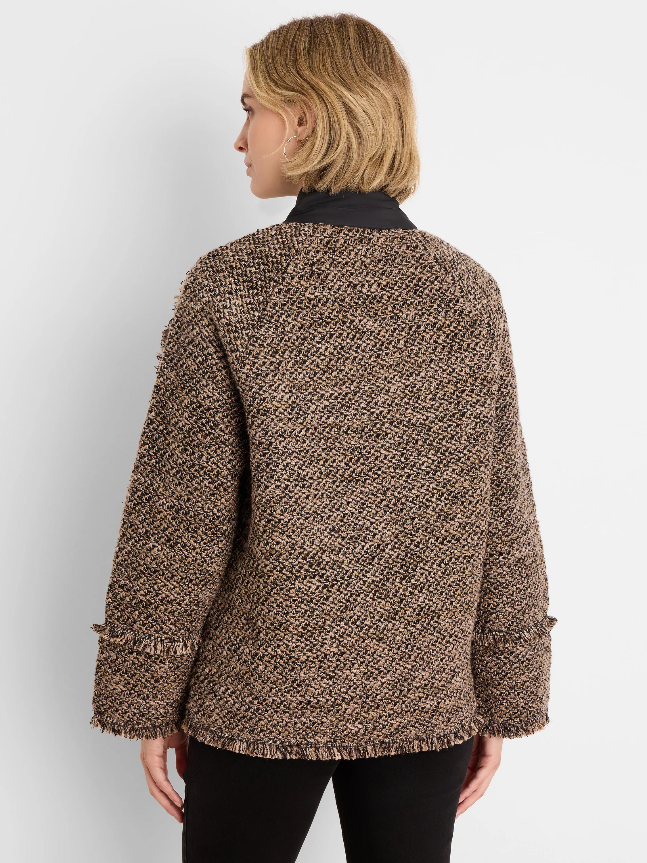 Brown, black, & tan mixed knit coat with a round neck and fringe at cuffs & hem.