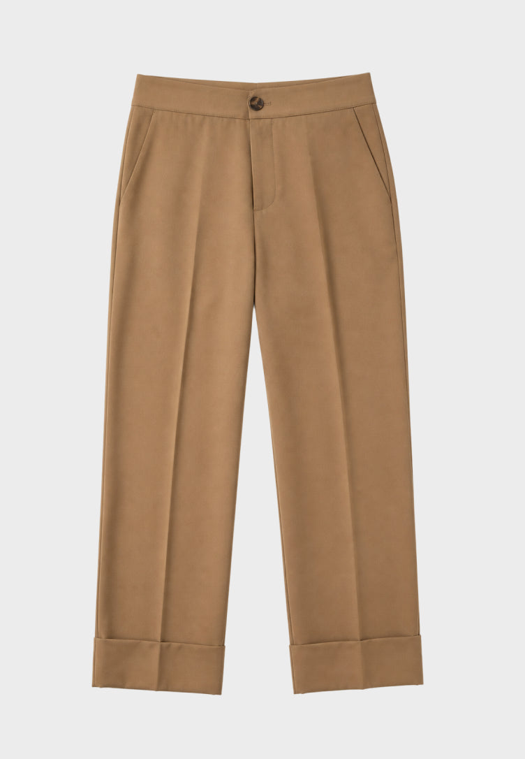 A pair of tan cropped trousers with a single button closure at the waist, displayed flat against a light gray background.