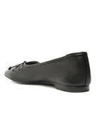Black square-toe ballet flat with a small tied knot detail on the front and a low heel.