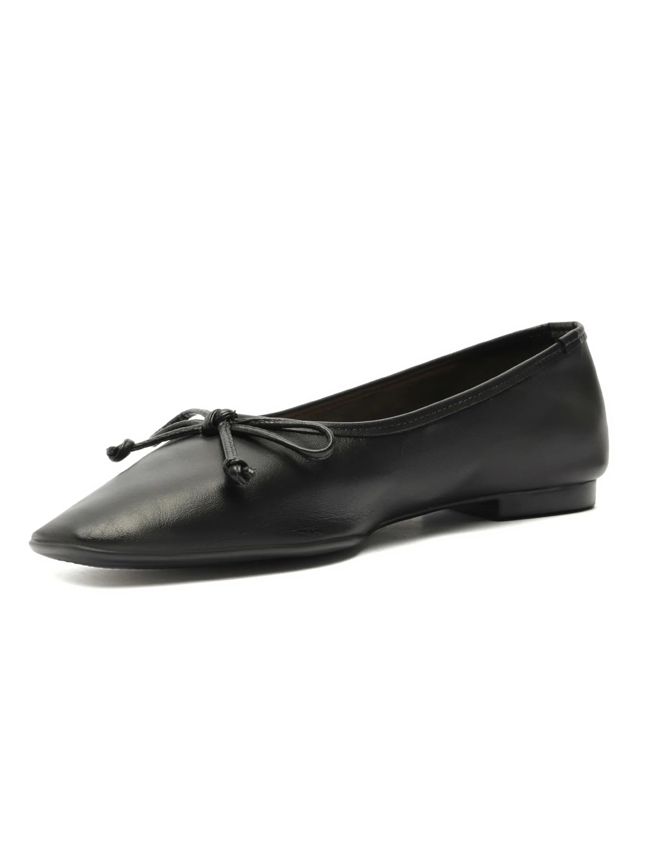Black flat shoe with a pointed toe and a small matching bow on the front.