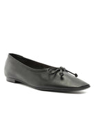 Black leather pointed-toe ballet flats feature a delicate bow detail on the vamp.
