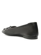 Black leather square-toe ballet flats offer a low heel and a small decorative knot detail at the vamp.