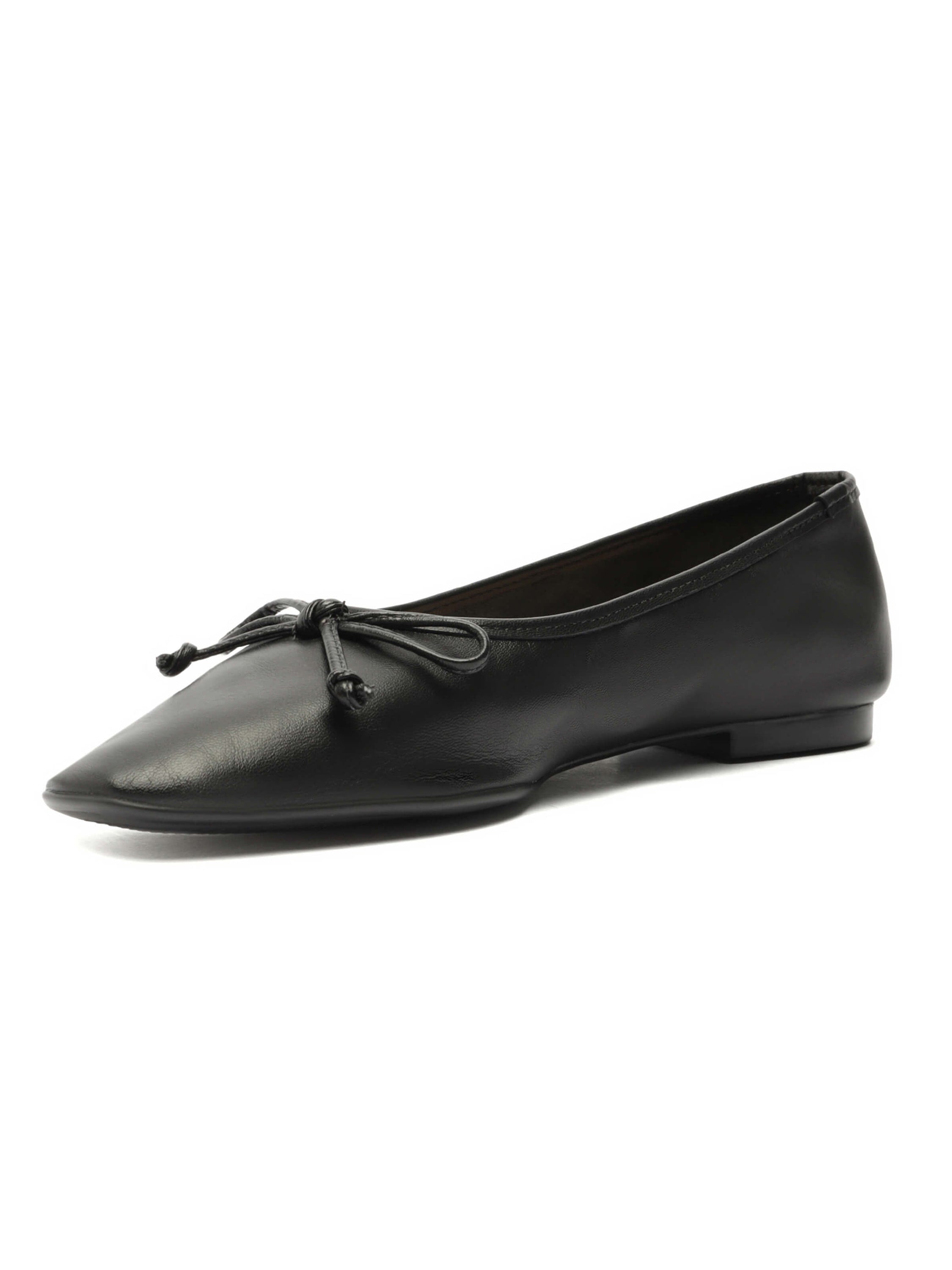 Classic black leather flats offer a pointed toe silhouette and are finished with a delicate self-tie bow detail.