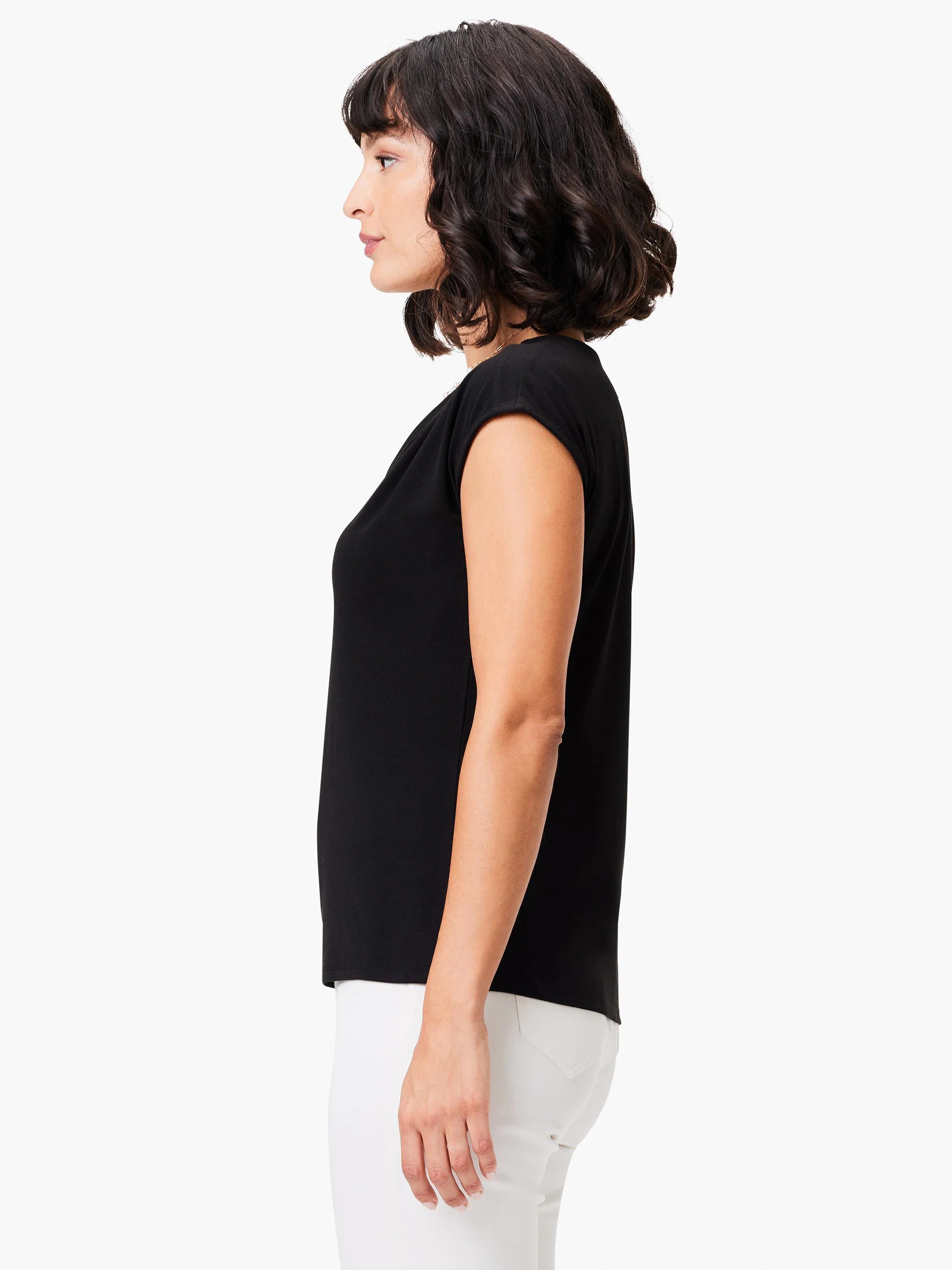 Black short-sleeved shirt, fitted silhouette.  Shown on a model.