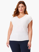 Off-white v-neck, short-sleeved jersey top.