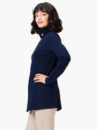 Navy blue, long-sleeved knit jacket; mock neck, zipper front, hip length.