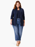 Navy blue, long-sleeve zip-front knit jacket.  Shown on model with jeans.