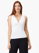 Off-white sleeveless jersey top; V-neck with center twist detail.