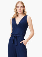 Navy blue sleeveless jersey top; twisted detail at neckline.