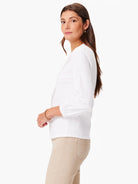 White, 3/4 sleeve top with light gray vine embroidery.