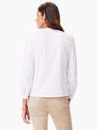 White long-sleeve top with slightly puffed sleeves.  Back view.